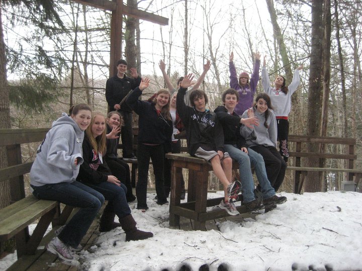 Teenagers posing for photo in snowy area